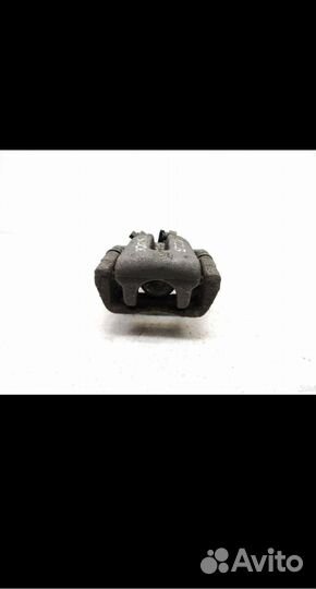 Суппорт тормозной задний левый Opel Zafira