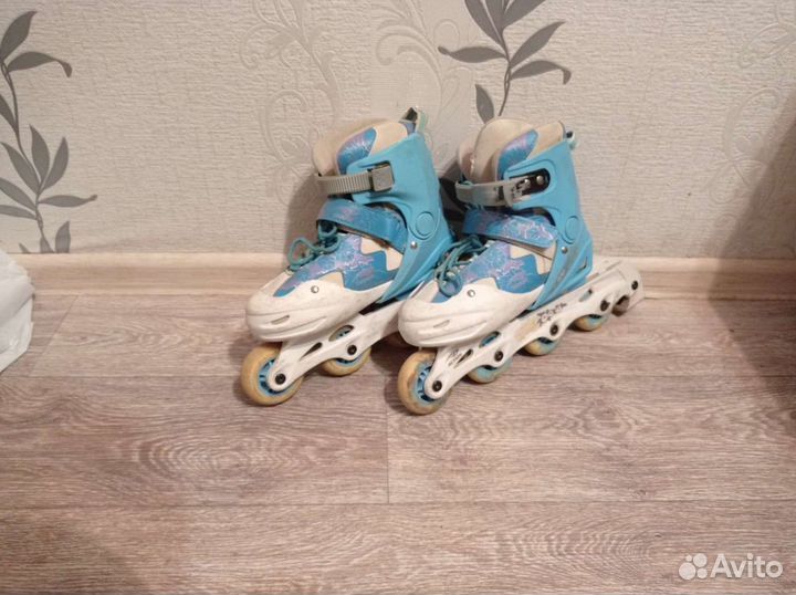 Роликовые коньки