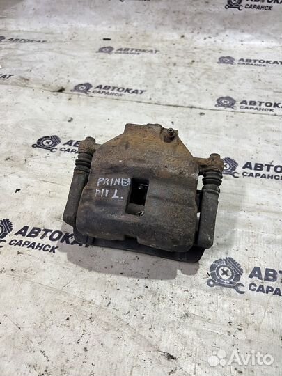 Суппорт передний левый Nissan Primera P11