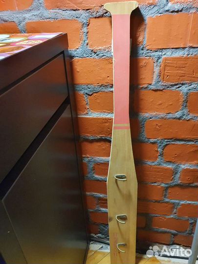 Вешалка стилизована под биту для лапты