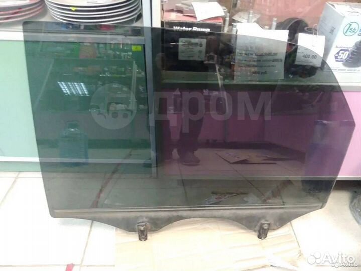 Стекло двери заднее левое Киа Спортаж 2009г