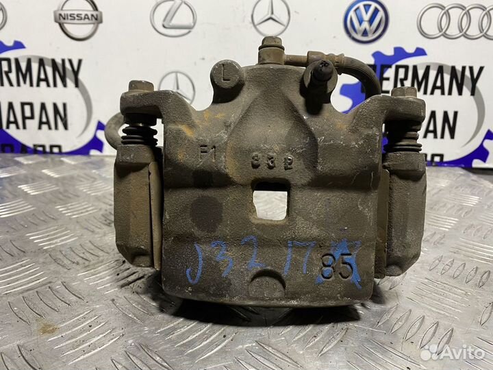 Передний левый суппорт Nissan Teana J32