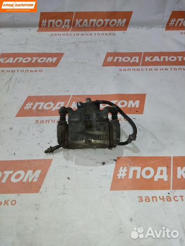 Суппорт тормозной передний левый Nissan Teana J32