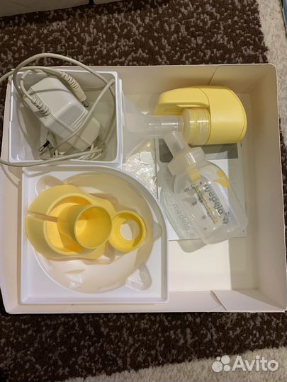 Молокоотсос medela электрический
