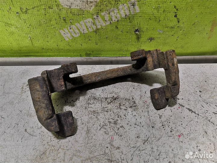 Скоба суппорта переднего Форд Торнео Коннект