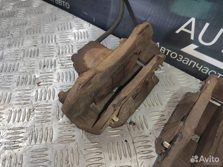 Тормозной суппорт передний Mitsubishi Lancer 9