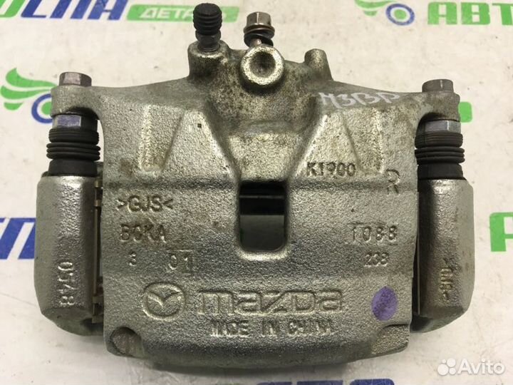 Суппорт тормозной передний правый Mazda 3 BP PE