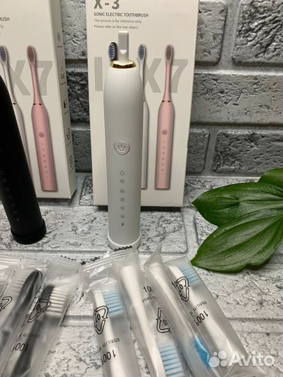 Электрическая зубная щетка