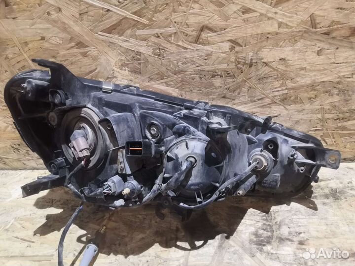 Фара левая б/у Mitsubishi Lancer 10