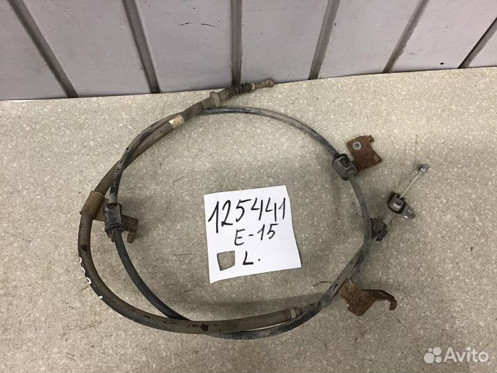 Трос стояночного тормоза левый Toyota Corolla E15