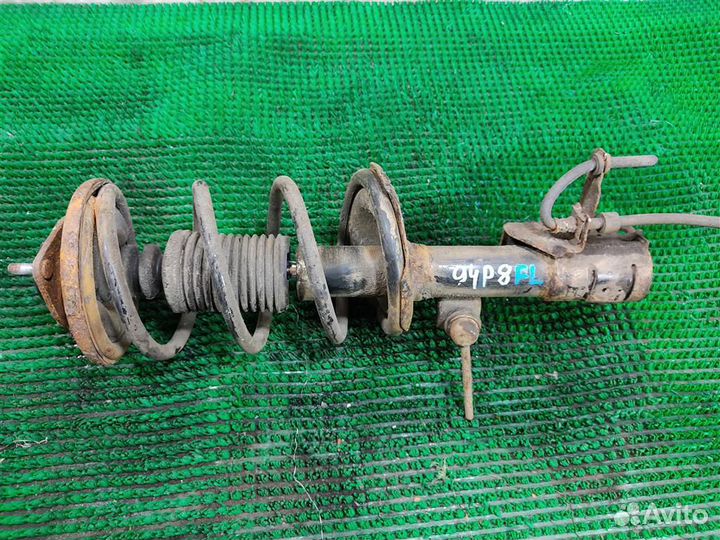 Стойка амортизатора передняя левая Mitsubishi Lan