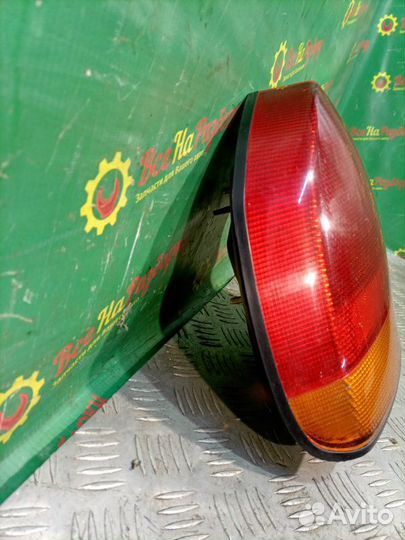 Фонарь задний левый Mitsubishi Carisma лифтбек 1.6