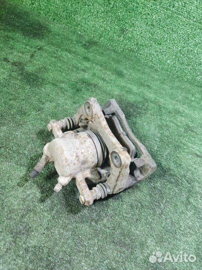 Суппорт тормозной передний левый Nissan Almera G15