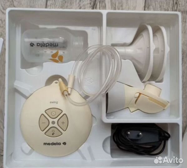 Молокоотсос medela электрический