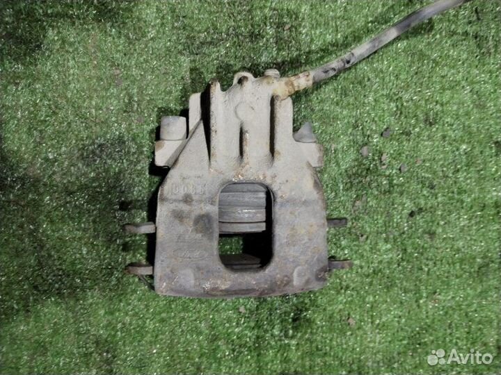 Суппорт тормозной передний левый Ford Focus 1.6