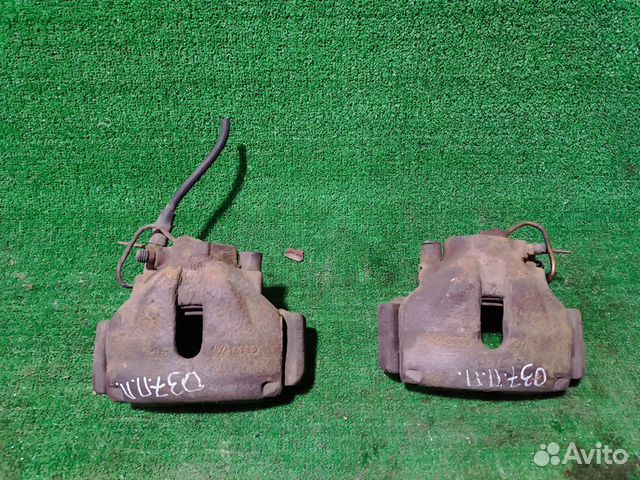 Суппорт тормозной передний Volkswagen Passat