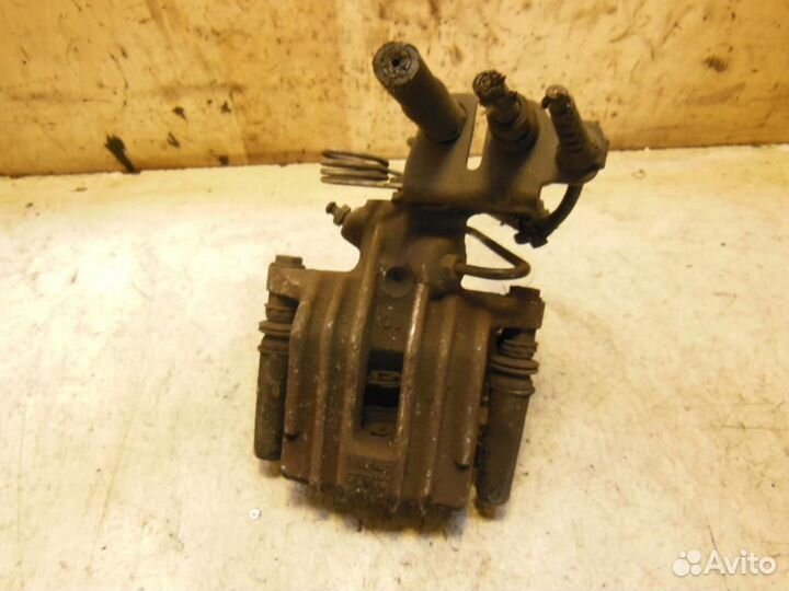 Суппорт задний правый Volkswagen Caddy