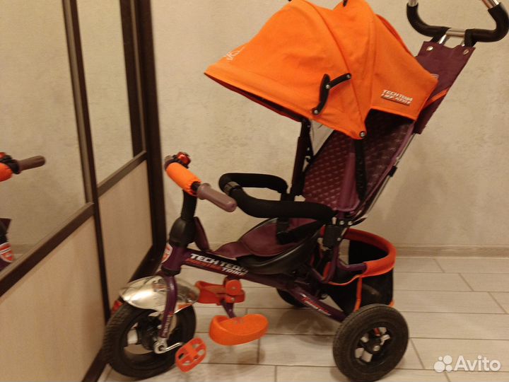 Трехколесный велосипед с ручкой