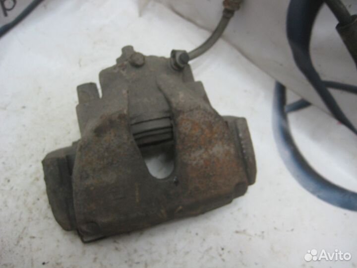 Суппорт тормозной передний левый Opel Astra H