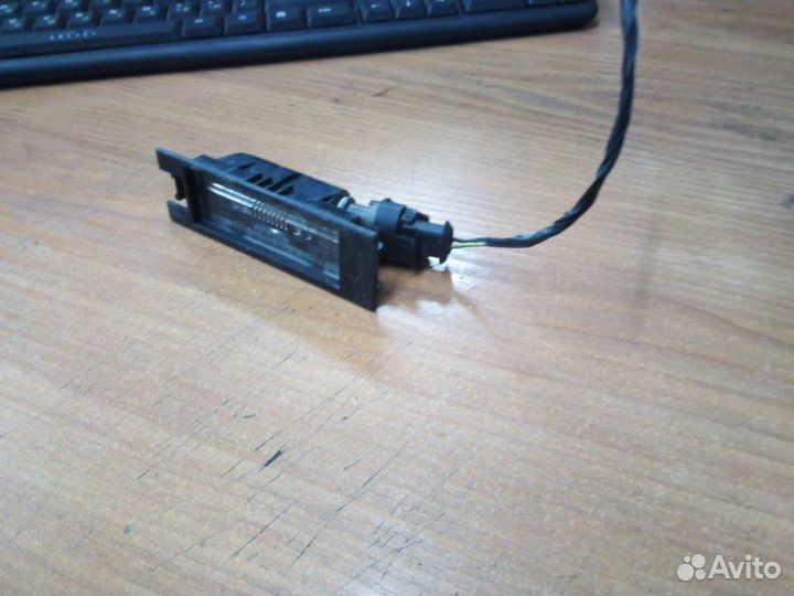 Фонарь подсветки номера Opel Astra J 68 A14XER