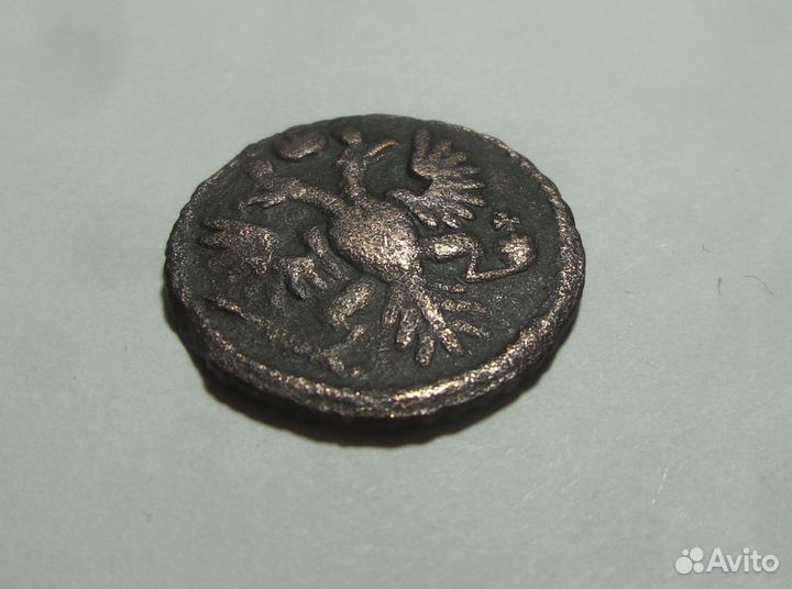 Монета Полушка 1734 перечекан из крестовой копейки