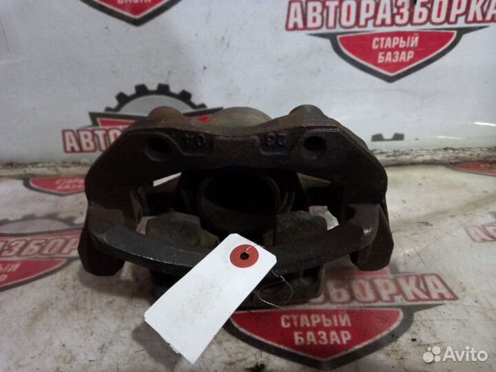 Суппорт тормозной передний левый Nissan Skyline