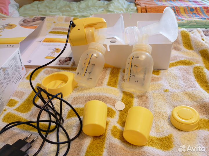 Молокоотсос medela электрический