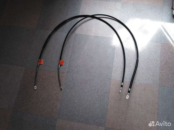 Трос привода ручного тормоза