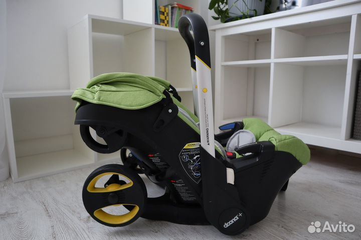 Коляска-автокресло Doona с базой isofix