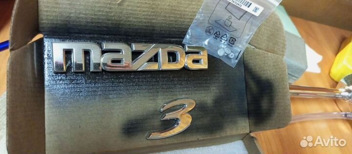 Эмблема mazda 3 bk