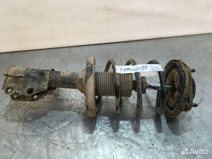 Стойка подвески передняя левая Mazda Familia седан