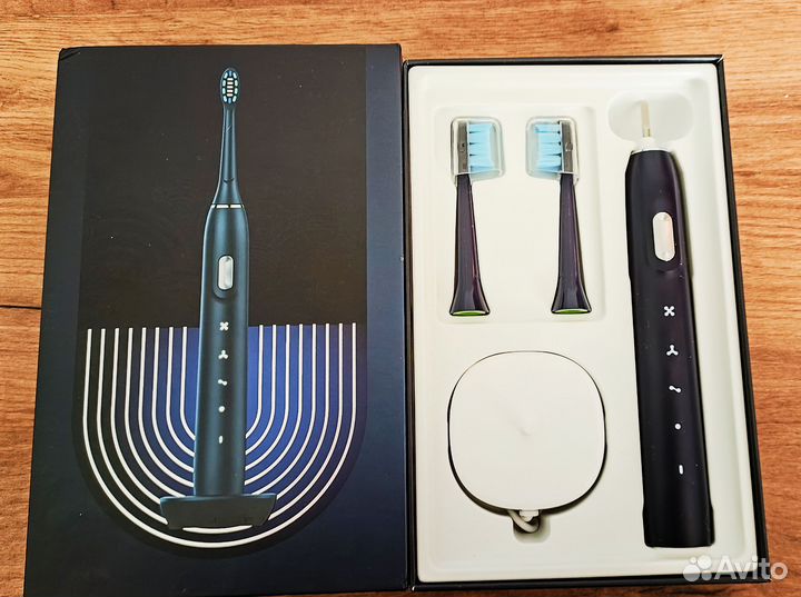 Электрическая зубная щетка