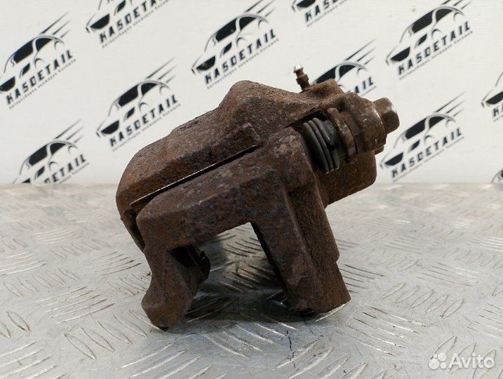 Суппорт тормозной передний левый Nissan Qashqai