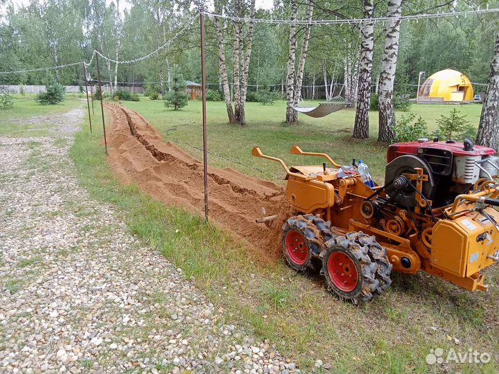 Копка траншей траншеекопателем