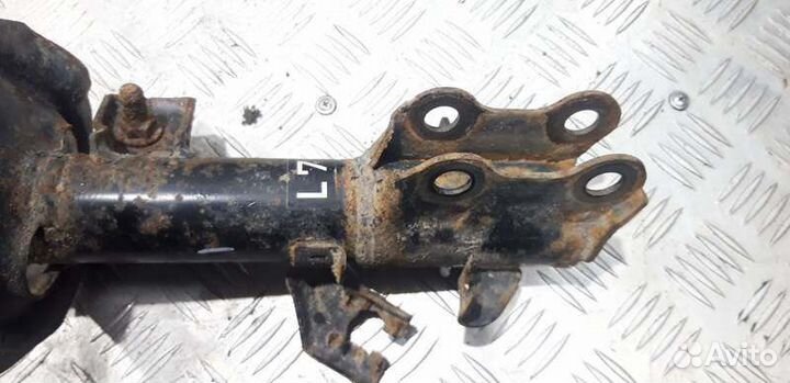 Амортизатор передний левый ориг. Nissan Tiida C11