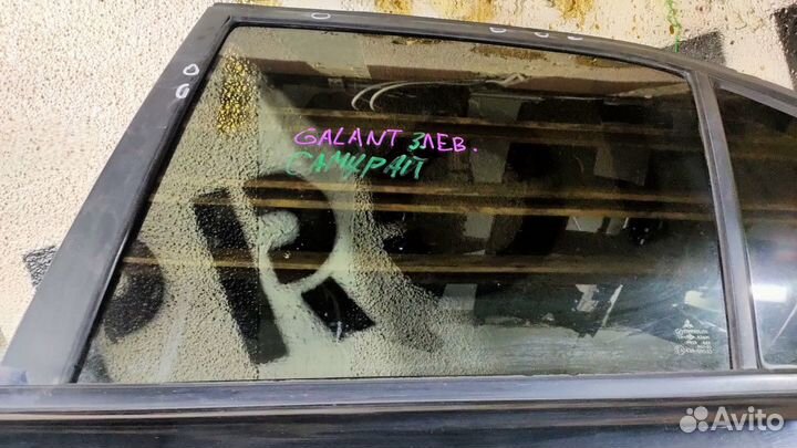 Стекло двери задней левой Mitsubishi Galant viii