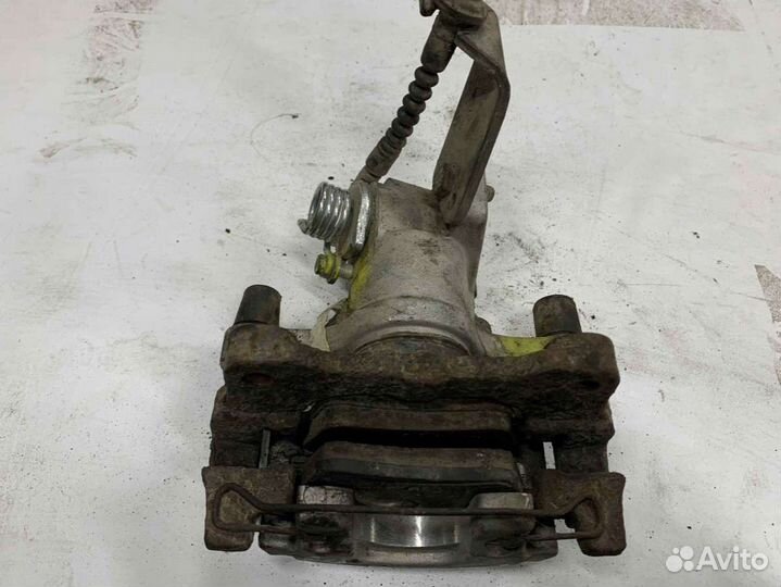 Суппорт тормозной задний правый Nissan Primera 12