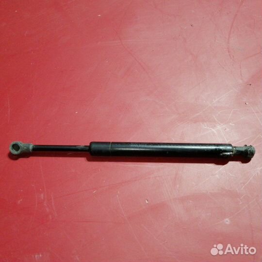 Амортизатор капота Nissan Teana