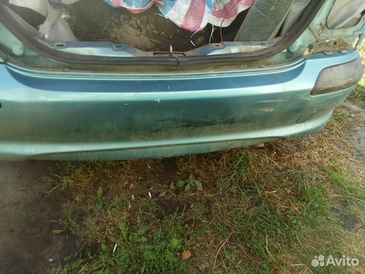 Ниссан Алмера Н16 хетчбек задний бампер цвет BW3K