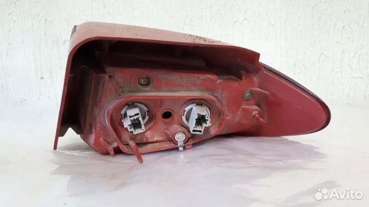 Фонарь задний левый Mazda Demio DBA-DY3W