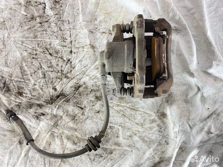 Суппорт тормозной передний левый Opel Corsa D