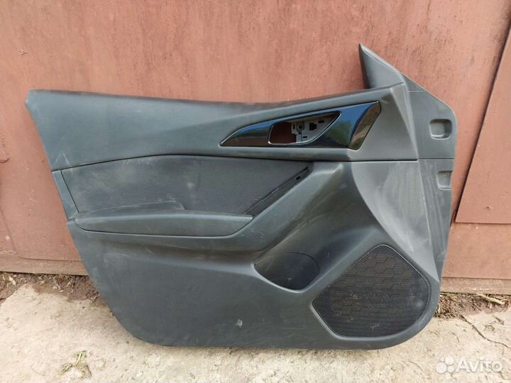 Обшивка двери Mazda 3