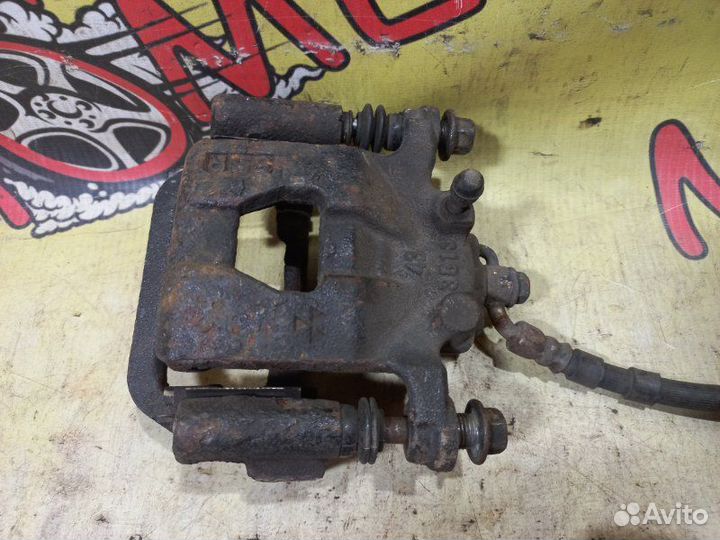 Суппорт тормозной задний правый Nissan Teana J31