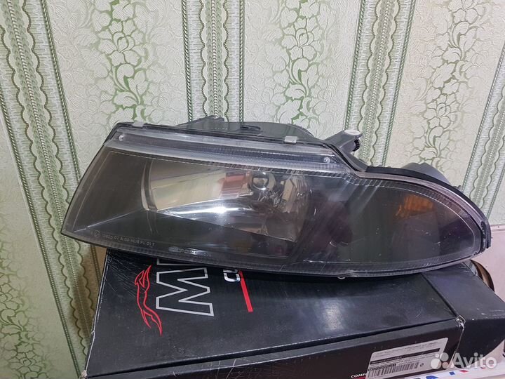 Фара левая митсубиси каризма