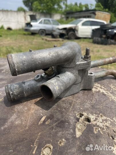 Корпус термостата Hyundai Elantra 3 XD ат G4GC