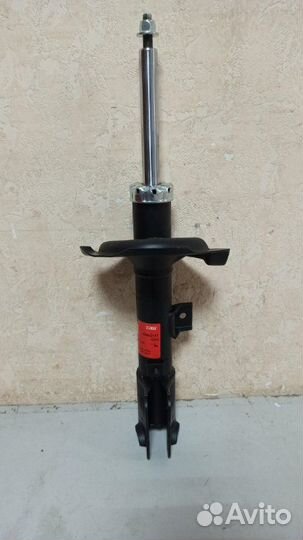 Амортизатор передний левый Mitsubishi Outlander XL