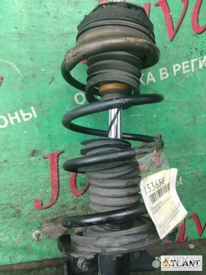 Стойка передняя левая mazda demio