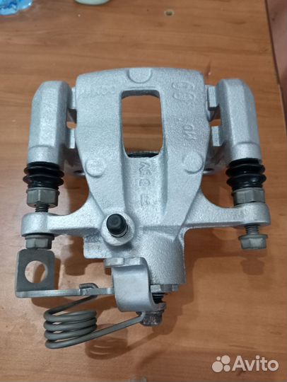 Суппорт тормозной задний kia rio 3,Солярис