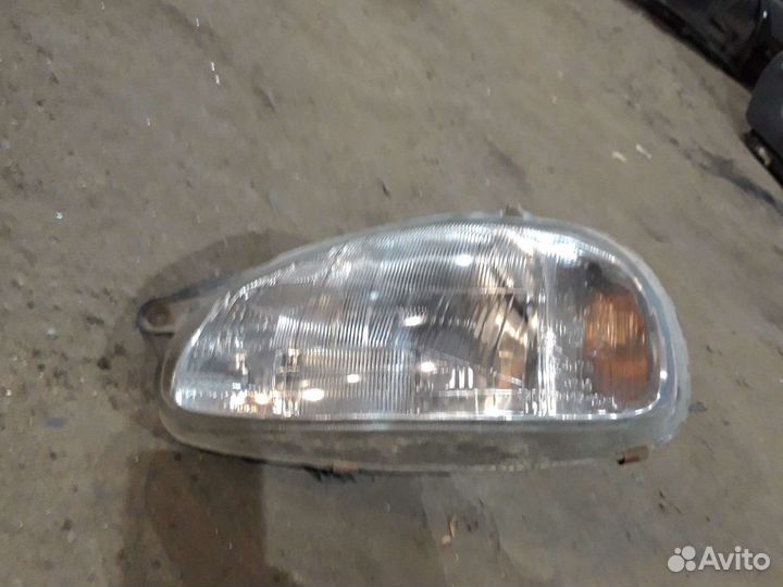 Фара левая Опель Корса В 94-00