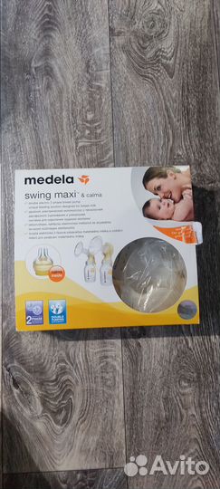 Молокоотсос medela электрический